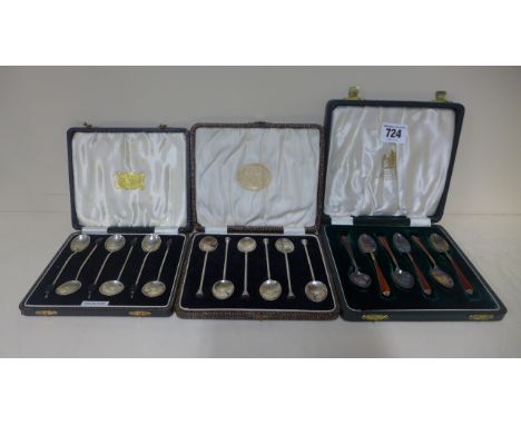 A cased set of six silver and enamel teaspoons with two other cased sets of silver coffee spoons, approx 5 troy oz, coffee sp