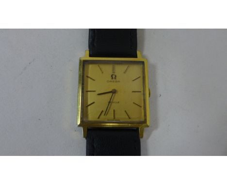 A gents gold plated Omega Geneve manual wind watch, in an Omega Box, 27mm without omega winding button, in good condition wit