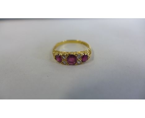 An 18ct diamond and ruby ring, size Q, approx 3.3 grams, generally good, minor abrasions 