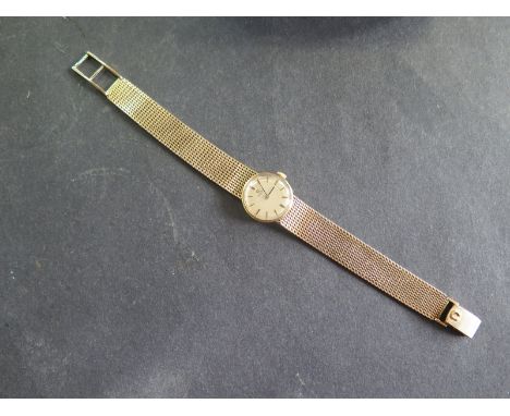 A ladies 9ct gold manual wind bracelet wristwatch 20mm wide including winder, 18cm long, approx total weight 32.6 grams, gene