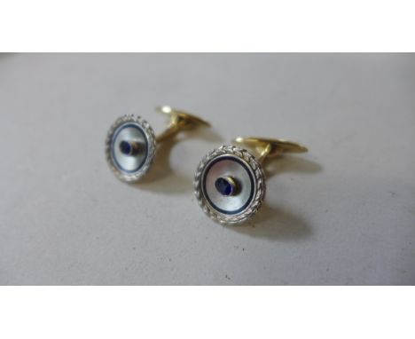 A pair of French designer 14ct gold platinum and sapphire cufflinks with blue enamel, one cufflink numbered 2090, numbers sli