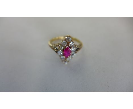 An 18ct gold diamond and ruby - diamond navette shape - ring set with ten diamonds 15x8mm ring head, size L, approx 3.4grams 