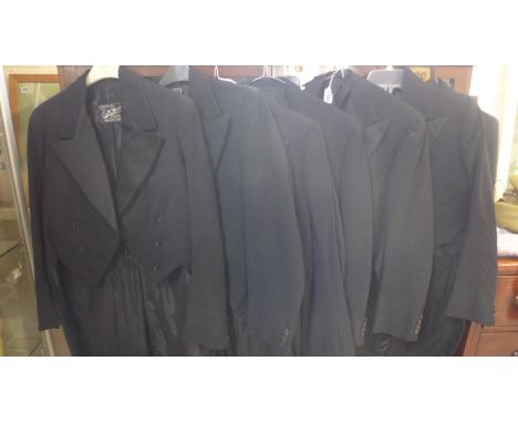 A collection of seven vintage tail coats, with nine pairs of trousers, with some signs of wear 