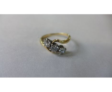 An 18ct yellow gold three stone diamond crossover ring, approx 1.15cts, with valuations certificate - size R, approx 4.2 gram