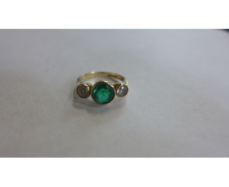 A 9ct yellow gold emerald and white stone three stone ring, size Q/R, approx 3.8 grams 