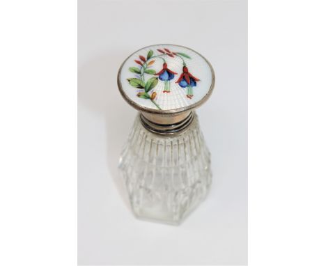 A silver and enamel topped cut glass scent bottle, height 8.5cm