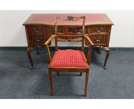 A mahogany serpentine fronted five drawer writing desk with red leather inset panel on Queen Anne style legs together with a 