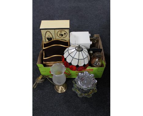 A box containing Tiffany style table lamp with shade, pair of brass hurricane lamps, two wooden jewellery boxes, wooden corre