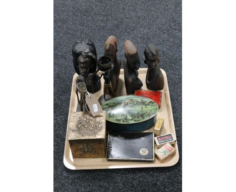 A tray containing cards, hardwood tourists figures, brass tea caddy, assorted tins and match boxes, small quantity of stamps