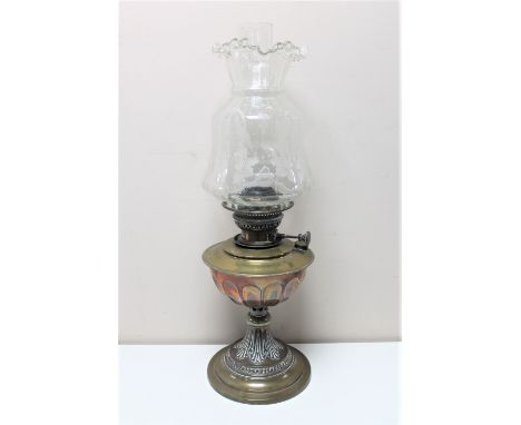 An antique brass Veritas oil lamp with glass chimney and shade 