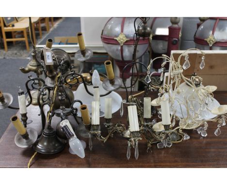 A quantity of assorted continental light fittings together with a brass oil burner in the form of a table lamp 