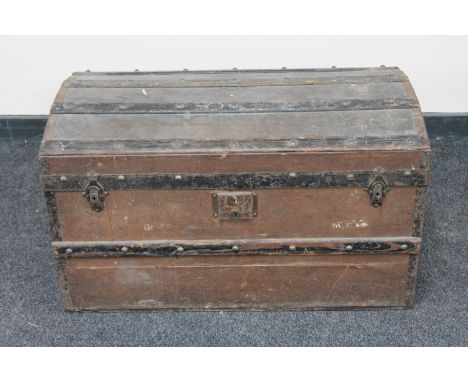 An early 20th century wooden bound shipping trunk 