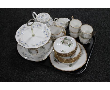 A tray containing a Duchess Tranquility teapot, sugar basin and milk jug, a two tier cake stand together with twenty-two piec