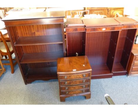 A small mahogany bow front chest of drawers with four drawers and two mahogany bookcases with adjustable shelves (3)