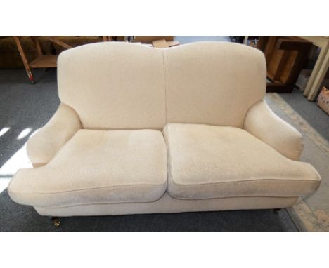 A modern two seater sofa in cream chenille fabric, 161 cm long x 90 cm deep x 90 cm tall