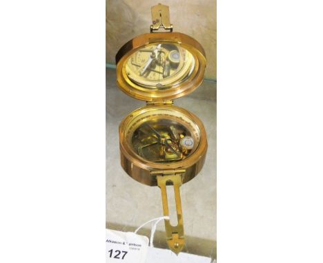 A brass cased military style compass