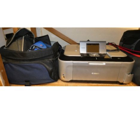 A camera bag and contents of filters, various cameras and a Cannon printer