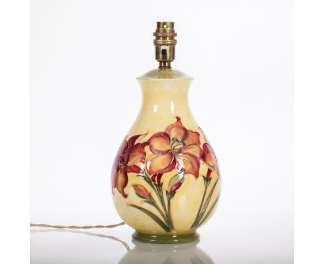 MOORCROFT 'AFRICAN LILY' PATTERN LAMP
decorated with a spray of three lilies to one side and a single stem to the other, all 