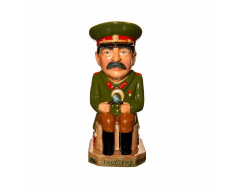 Tall Toby jug of Joseph Stalin. Dressed in Soviet uniform and seated on a pedestal with communist imagery on it. A bear is th