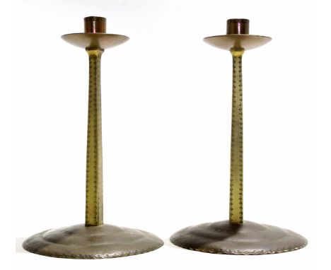 Russell &amp; Sons pair of Arts &amp; Crafts "Lygon" brass candlesticks, possibly manufactured in the Lygon Arms workshops, w