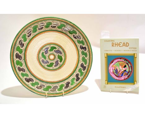 Crown Ducal charger with tube lined decoration by Charlotte Rhead, together with a book entitled "Collecting Rhead Pottery" b