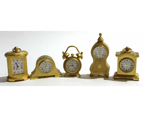 Group of small brass clocks modelled as ships steering and other mantel clocks (qty)