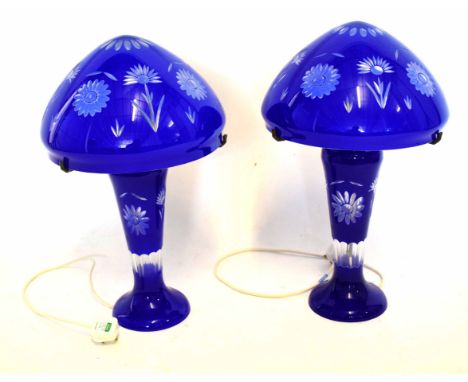 Pair of blue glass lamps and shades with an etched floral design to shades and lamp