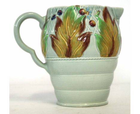 Clarice Cliff Celtic Harvest jug with ribbed body and a floral design above with Clarice Cliff facsimile signature and Newpor