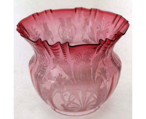 Late 19th century cranberry glass oil lamp shade with a floral design and crimped rim