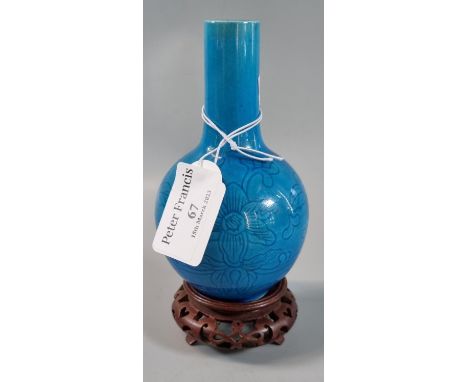 Small Chinese porcelain baluster vase on a stand with a scrolling lotus motif on a turquoise enamel ground, probably 19th cen