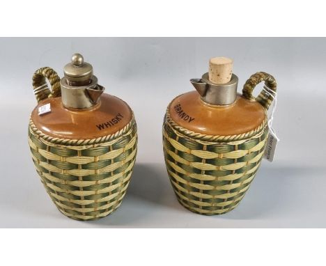 Two stoneware brandy and whisky jugs with silver plated collars, wicker handle and body.  (2)  (B.P. 21% + VAT) 