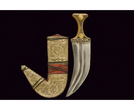 dating: early 20th Century provenance: Yemen, Large, curved, double-edged, flat blade. Brown grip, adorned with two, gold coi