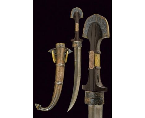 dating: circa 1900 provenance: Morocco, Curved, single-and false-edged blade, with tang. Wooden grip with silver and brass mo