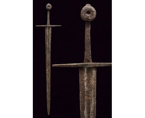 dating: 13th Century provenance: Germany, Wide, straight, double-edged blade with central fuller, remains of brass inlays on 