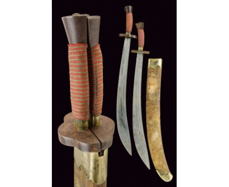 dating: circa 1900 provenance: China, Wide, curved, single-edged blades with double fuller; iron hilt, the two quillons formi