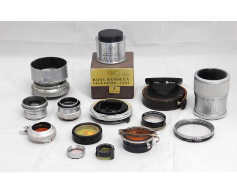 A quantity of lenses and accessories: to include a Plaubel AG Frankfurt AM no. 107208 Anticomar f-10cm; a Ross Resolux Enlarg