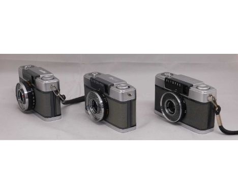 Three Olympus camera's: an Olympus-Pen Pen-EE, serial no. 985604; an Olympus-Pen Pen-EE, serial no. 816088; and an Olympus Pe