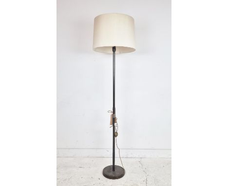 STANDARD LAMP, with a bronzed column and cream shade, 179cm tall overall.