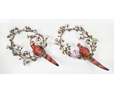 PARROTS AMONGST FLORAL DISPLAY WALL HANGINGS, a pair, glazed ceramic and gilt metal, 77cm drop each approx. (2)
