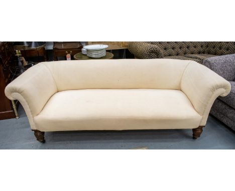CHESTERFIELD SOFA, Victorian mahogany and gilt in old calico on ceramic castors, 67cm H x 200cm x 80cm.