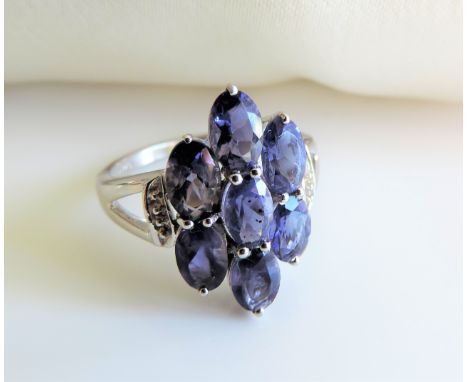 Sterling Silver 2.4ct Tanzanite Ring New with Gift Box.A lovely ring set with 7 Oval 5x3mm Tanzanites (2.45cts). Marked 925. 