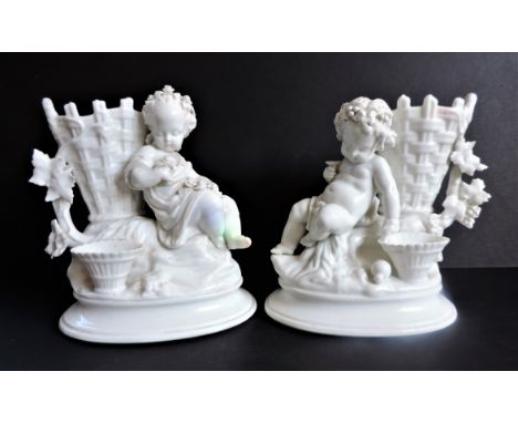 Antique  Blanc de Chine Porcelain Cherub Vases. A beautiful pair of Blanc de China porcelain cherub vases 18cm high and 16cm 