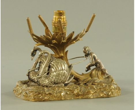 A silver plated lamp base, in the form of a cherub with swan.  Length 21 cm. 