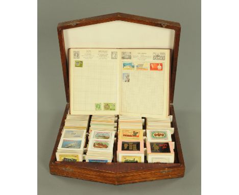 A large collection of Vintage matchbox labels (100's), and the improved postage stamp album containing a small collection of 