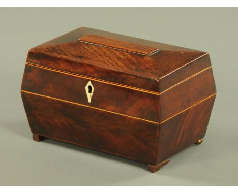 An early 19th century mahogany tea caddy, with two interior divisions, being boxwood strung and raised on short feet.  width 