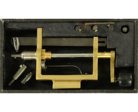 Clock / Watchmaker tools - a brass main spring winder with accessories and in fitted case.  22.5 cm long including handle.