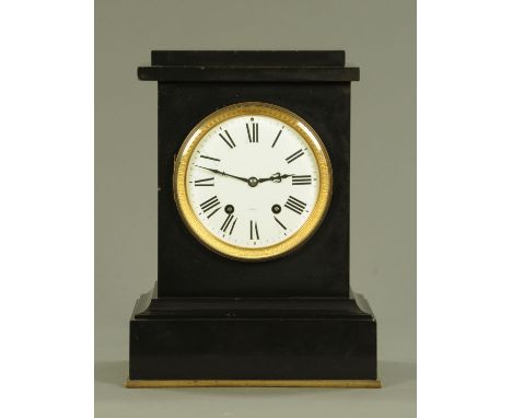 A 19th century French polished black slate mantle clock, with eight day movement striking on a gong stamped SF, all upon a gi