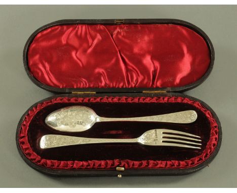 A silver christening set, comprising spoon and fork, foliate engraved, Walker &amp; Hall, Sheffield 1887.  