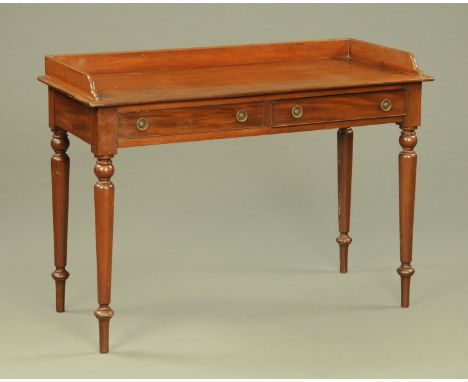 A 19th century mahogany washstand, with three quarter gallery and two frieze drawers raised on turned tapered legs.  Width 12