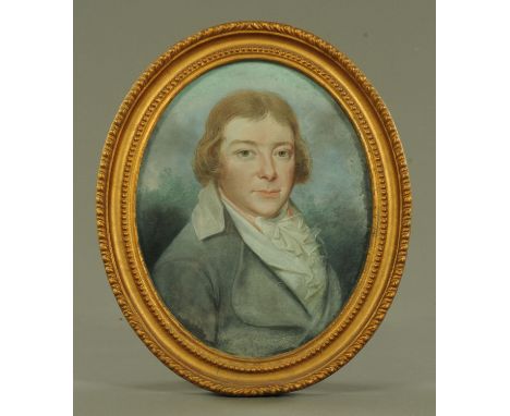 A late 18th century watercolour portrait, gentleman in blue coat, oval.  28 cm x 23 cm, framed, inscribed verso "Ian Wilkinso